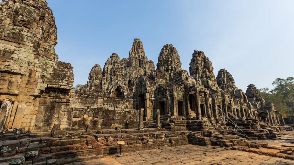 Group of Buddhist Monks in Front of Angkor Wat Temple
